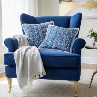 Coussin huipil birds sur sofa bleu